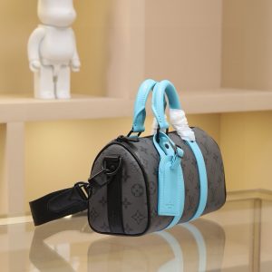 Alternative view of 🔥M11645 Full Metal Hardware This Keepall Bandoulière 25 bag features Monogram Eclipse Reverse canvas with leather trim, accented by bright-colored reinforced side straps, handles, and signature plaque. Its compact silhouette is enhanced with matte metal hardware and a removable, adjustable fabric shoulder strap.25 x 15 x 11 cm (Length x Height x Width)